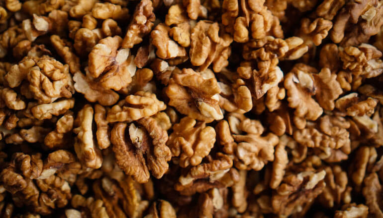 Aerial view of a cluster of brown walnuts that are healthy for your teeth