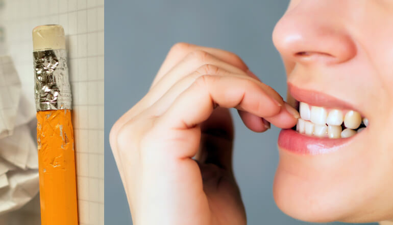 Woman biting her nails next to a pencil that has been chewed on