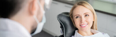 smiling woman sitting in a dental chair